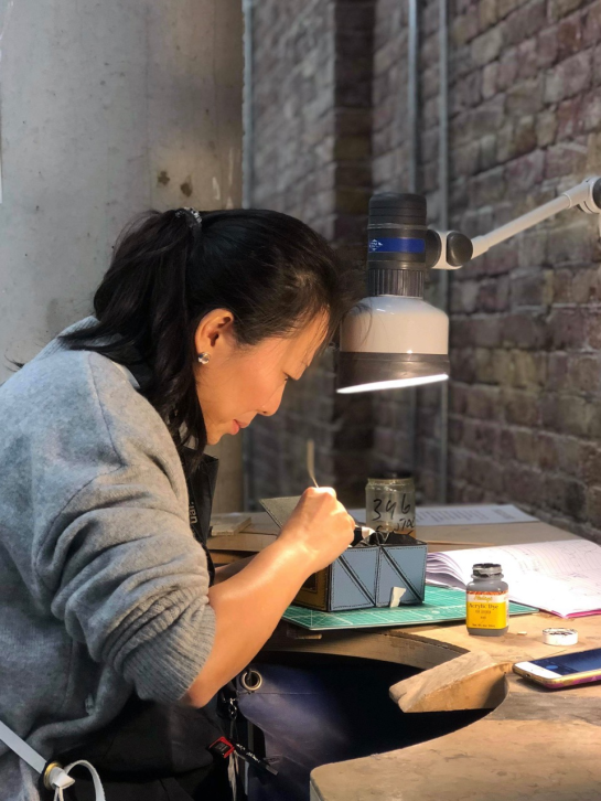 Picture of Mizuki Tochigi working in the jewellery workshop